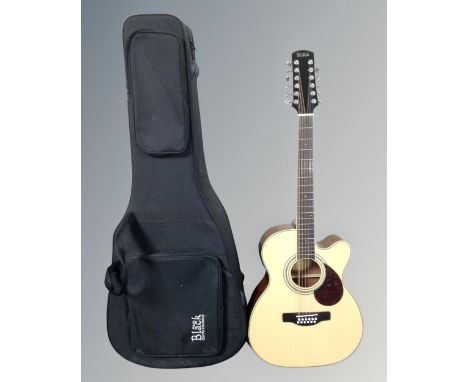 An Adam Black model 0-5CE-12/N 12-string semi-acoustic guitar in carry case 