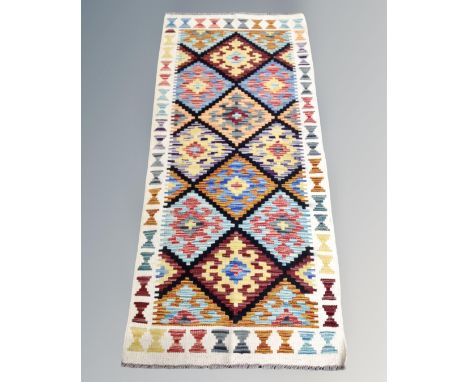 A Chobi kilim runner 146cm by 65cm