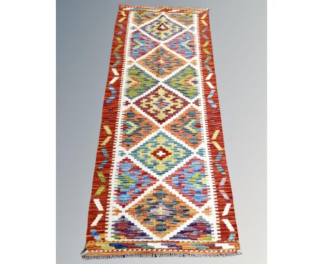 A Chobi kilim runner 161cm by 65cm
