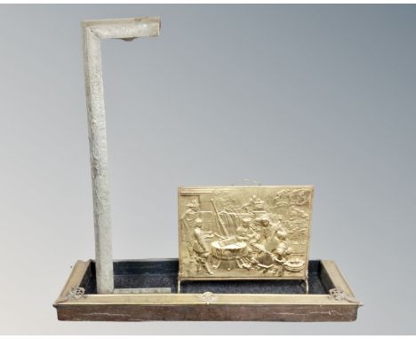 A 19th century Art Nouveau copper and brass fire curb together with a further fire curb and a brass embossed fire screen.