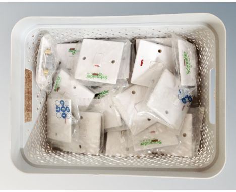 A Curver caddy containing 18 light switches.