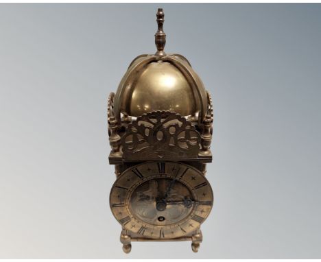 A brass lantern clock.