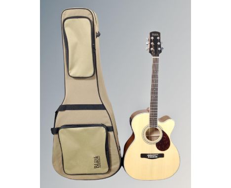 An Adam Black model 0-5CE semi-acoustic guitar in carry case 