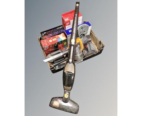 A Dyson hand held vacuum with wall mounting bracket and charger together with an AEG Ergorapido Plus stick vacuum, Christmas 