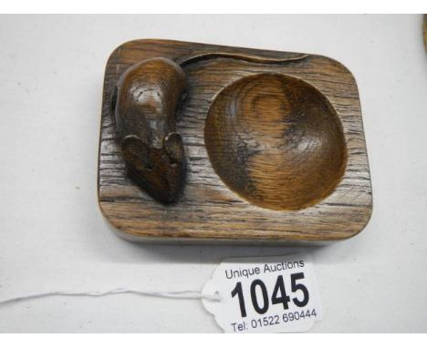A Mouseman oak ashtray.