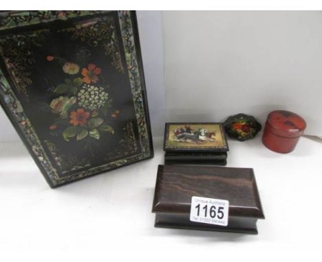 A Russian Lacquered snuff box, three other boxes and a lacquered blotter. 