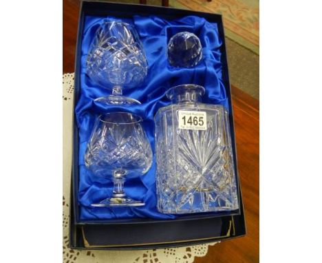 A boxed Bohemian crystal decanter and two brandy goblets.All pieces in good condition