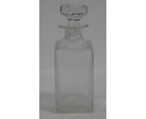 A Cartier French cut square crystal decanter with star cut design stopper. Signed to the base. H.25cm 