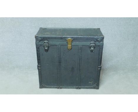 A late 19th century metal bound travelling trunk with fitted lift out compartments. H.81 W.86 D.38cm 