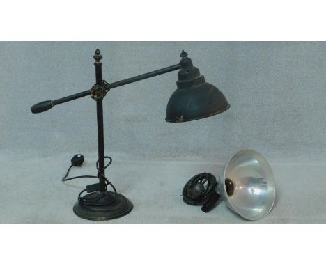 Two vintage industrial lights. One black enamel table lamp with adjustable arm and metal shade and a braided wire vintage cei