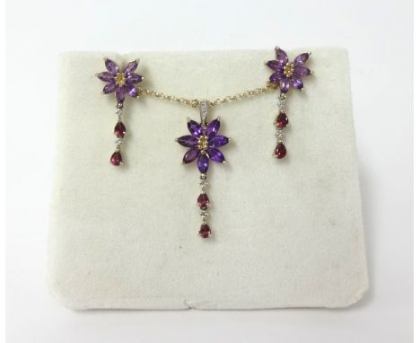An amethyst, ruby and diamond set of jewellery, total weight 7.9gms.