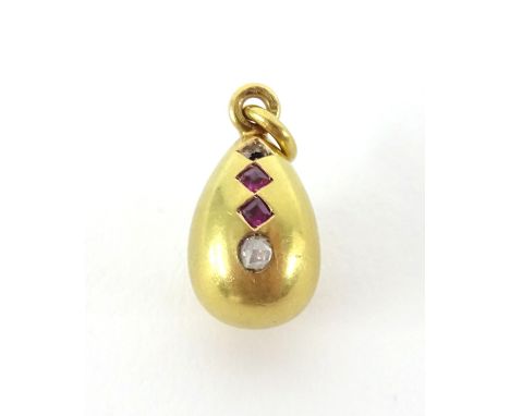 An 18ct ruby and diamond egg pendant.