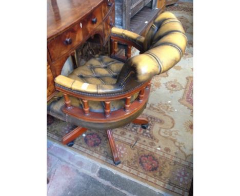 A BUTTON LEATHER SWIVEL OFFICE CHAIR