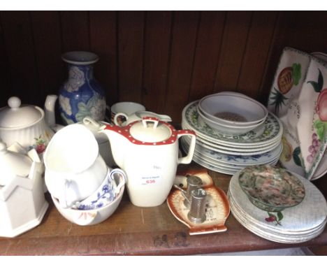 SHELF OF POTTERY
