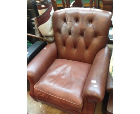 A BROWN BUTTON BACK LEATHER ARMCHAIR W90CM H100CM D95CM