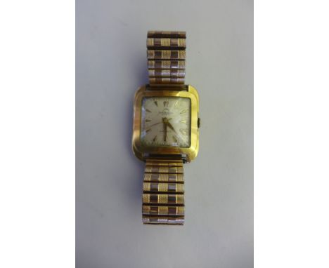 A Jean Richard Geneve Automatic gold plated gents wristwatch on a sprung strap, 32mm wide including button, not working, some