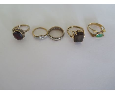 A 9ct ring, approx 3.5 grams, and an 18ct diamond ring, approx 2 grams, a gold and silver ring, a gilt metal ring and a 14ct 