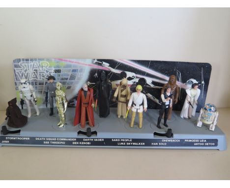 A rare vintage Star wars first twelve action figure, Action Display stand with full set of figures, all complete and good - G