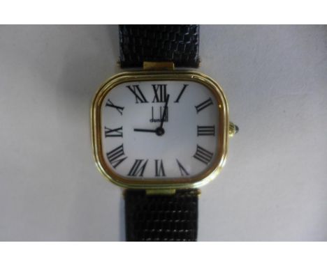 A silver gilt gents Dunhill quartz wristwatch in good condition with new battery, 35mm wide including button 