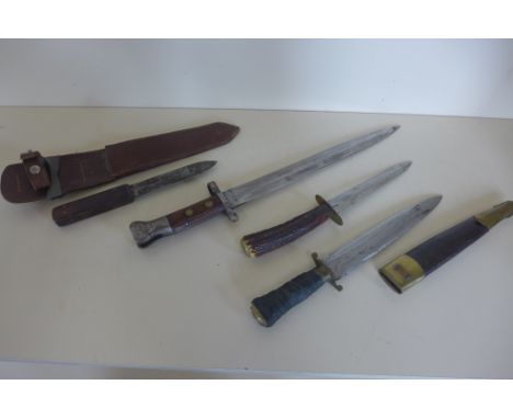 A bayonet marked VR 10,98 WD 53E - 42cm long, two fighting/hunting knives and an Eastern dagger 