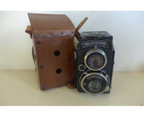 A Voitlander superb twin lens camera with leather case 