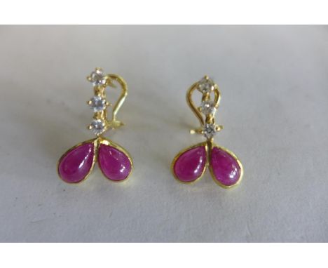 A pair of 18ct diamond and ruby earrings with Omega clips, approx 6 grams, in good condition 