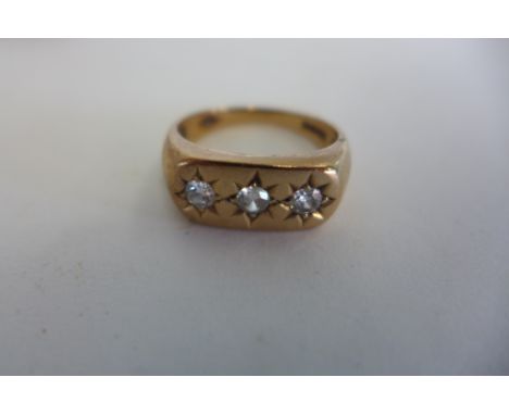 A 9ct gold three stone diamond ring, size T, approx 5.7 grams, some usage marks, diamonds bright 