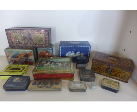 A collection of thirteen vintage tins and a small hip flask 