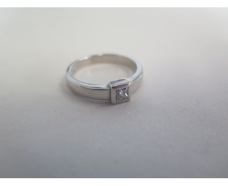 An 18ct white gold solitaire diamond ring, approx 0.20ct, ring size M, approx 4.6 grams, diamond bright, some usage marks, bu