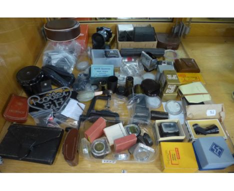 A good collection of assorted camera attachments, including a Rollei shop stand 