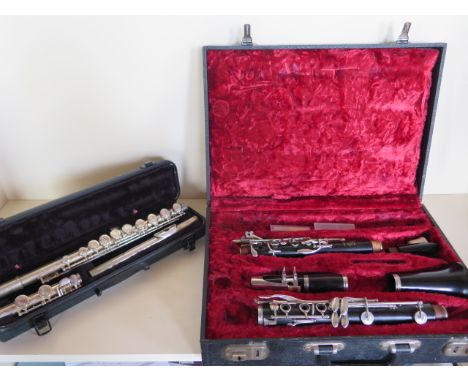 A Bossey and Hawkes Edgeware clarinet, cased and a flute 