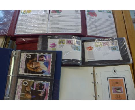 Five albums of Royal family stamps and first day covers and an album of cards 