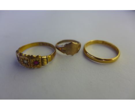 A 22ct gold band ring, approx 1.9 grams, an 18ct ring, approx 2.6 grams, and a childs 9ct ring, approx 0.7 grams 