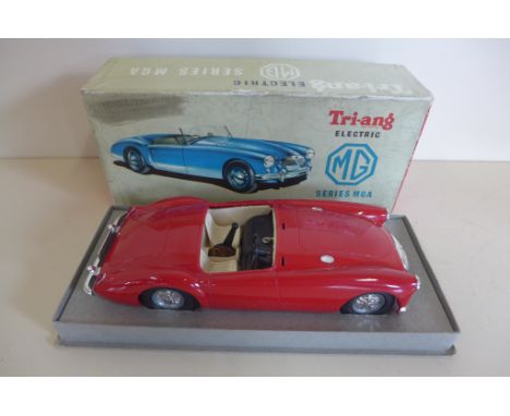 A Tri-ang electric MG series MGA car, boxed but broken screen and battery cover missing- not tested 