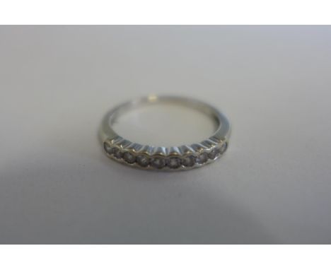 An 18ct white gold, ten stone diamond ring, approx total 0.25ct ,ring size L, approx 2 grams 