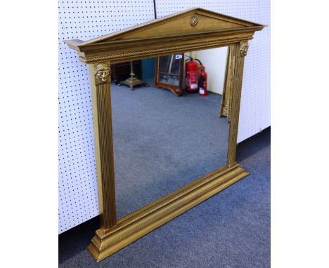 A 20th century gilt overmantel mirror, with architectural crest over reeded and face mask mounted frame, 154cm wide x 140cm h