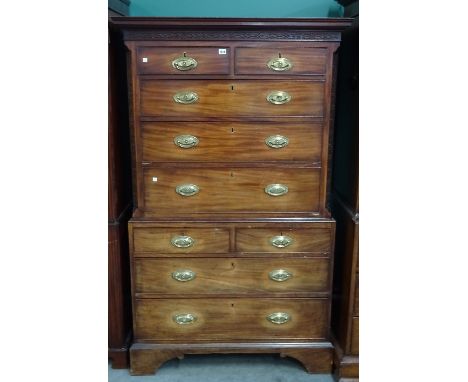 A George III mahogany chest on chest, of two short over three long drawers, the lower with two short and two long drawers, on