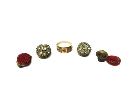 A Victorian 15ct gold, ruby and seed pearl set ring, star set with a cushion shaped ruby at the centre, between seed pearl se