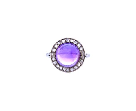 A cabochon amethyst and rose diamond set ring, mounted with the cabochon amethyst at the centre, in a surround of rose cut di