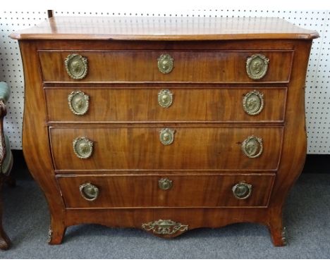 An 18th century German gilt metal mounted mahogany commode, the serpentine top over a bombe four drawer base, 100cm wide x 49