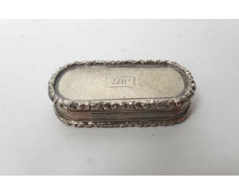 A William IV silver vinaigrette, of curved rectangular form, gilt within and with a scroll pierced and engraved grille, the e