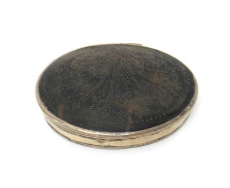 A silver mounted tortoiseshell oval hinge lidded snuff box, the lid with traces of pique decoration in a fanned design, proba