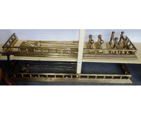 Two Victorian style brass fenders, each with pillared supports and stepped kerb, 144cm long, a matching pair of andirons, thr