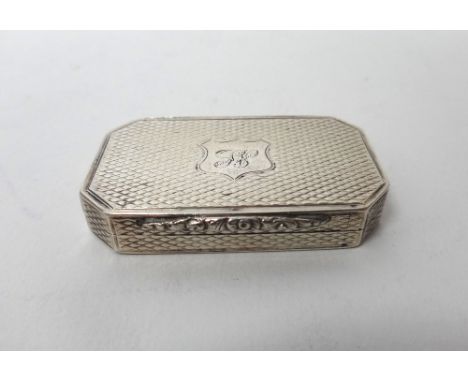 A Victorian silver vinaigrette, of cut cornered rectangular form, gilt within, with a feathered scroll pierced and engraved g