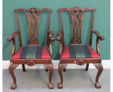 A pair of Chippendale Revival mahogany framed carver/open armchairs, with pierced splat on ball and claw feet, 60cm wide x 10