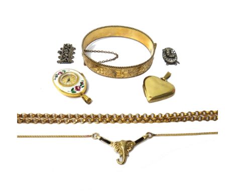 A gold necklace, the front designed as the head of an elephant, a gold circular link neckchain, with a base metal clasp, comb