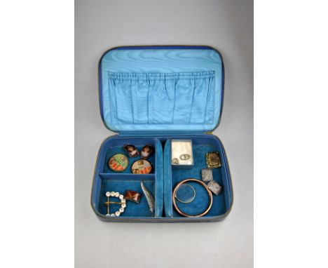 Blue leather jewel box containing various items including unmarked tubular bangle, cut steel show buckles, paste set buckles,