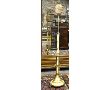 A Victorian brass and ceramic telescopic standard lamp with gilt floral and foliate decoration (converted to electricity)