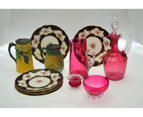 Five Coalport plates decorated with gilt edged reserves painted with pink roses to/w a cranberry glass decanter, water jug, s