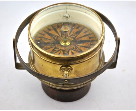 An antique brass cased nautical gimble framed compass, 14 cm diam